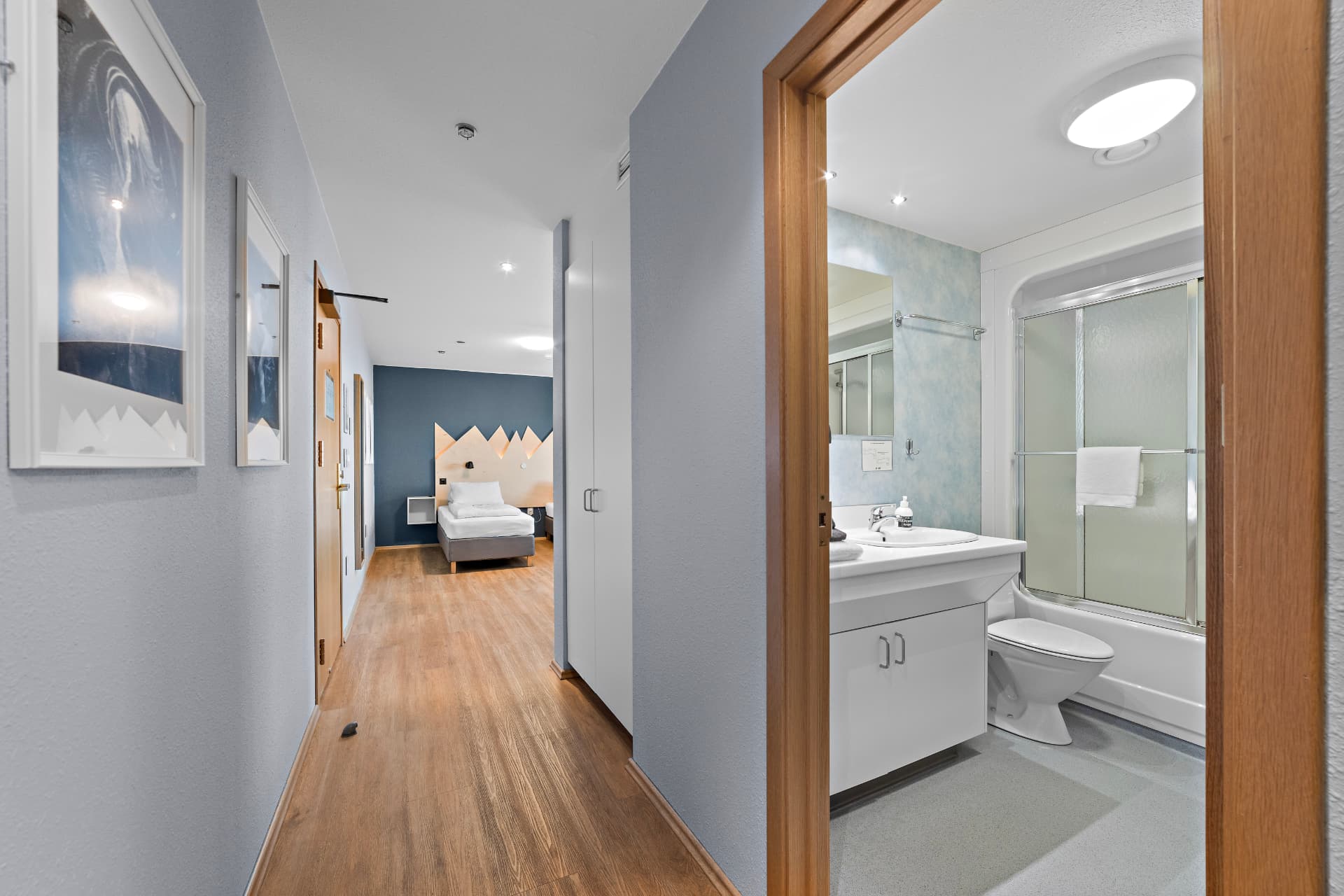 Family room corridor with private bathroom and bedroom view at START Hostel