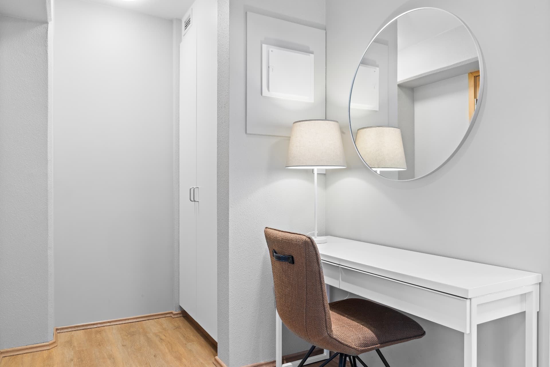 Desk, mirror and wardrobe corner in a double room at START Hostel